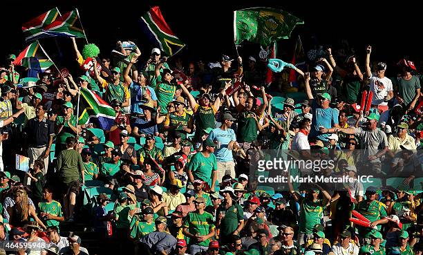 South African fans celebrate a six by AB de Villiers during the 2015 ICC Cricket World Cup match between South Africa and the West Indies at Sydney...