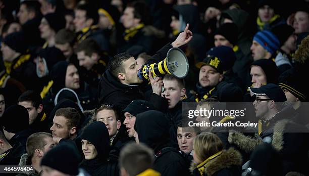 Young boys fans cheer on their team during the UEFA Europa League Round of 32 match between Everton and BSC Young Boys on February 26, 2015 in...