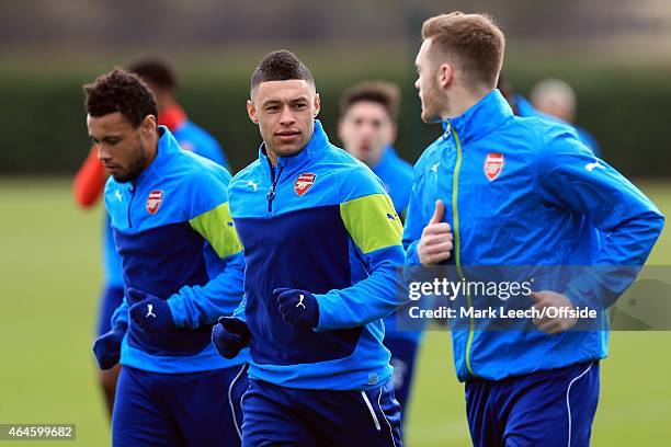 Alex Oxlade-Chamberlain of Arsenal with Francis Coquelin and Calum Chambers of Arsenal during the Arsenal training session ahead of the UEFA...