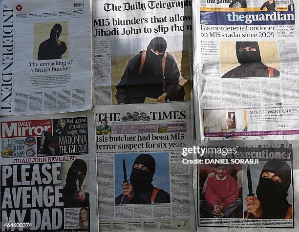 An arrangment of British daily newspapers photographed in London on February 27, 2015 shows the front-page headlines and stories regarding the...