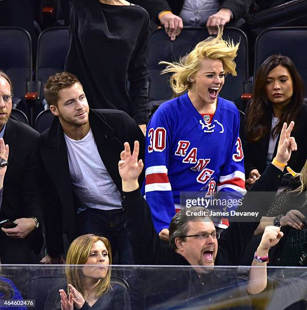 Tom Ackerley and Margot Robbie attend the Arizona Coyotes vs New York Rangers game at Madison Square Garden on February 26, 2015 in New York City.