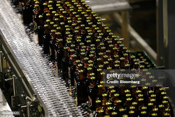 Bottles of Meta beer pass along the bottling line at the Meta Abo brewery, operated by Diageo Plc in Sebeta, Ethiopia, on Wednesday, Feb. 25, 2015....