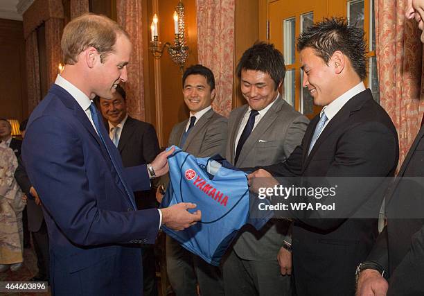 Members of the Japan Rugby World Cup Squad meet Prince William, Duke of Cambridge and present him with a shirt for Prince George at a reception at...