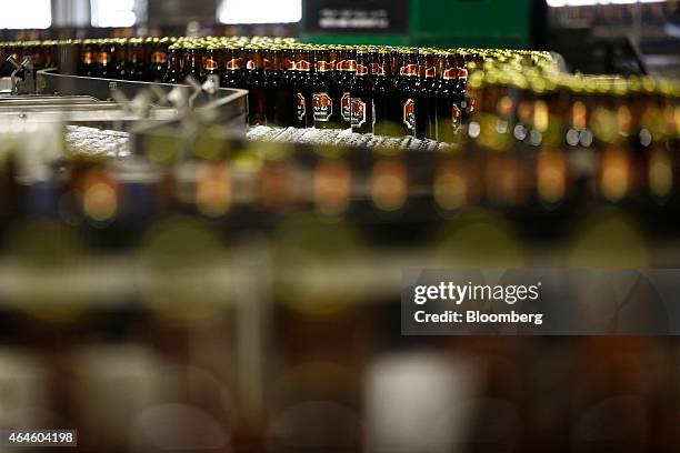 Bottles of Meta beer move along a conveyor belt on the bottling line at the Meta Abo brewery, operated by Diageo Plc, in Sebeta, Ethiopia, on...