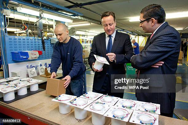 Prime Minister David Cameron with Chief Executive Ronnie George during his visit to the headquarters of ventilation manufacturer, Vent-Axia on...