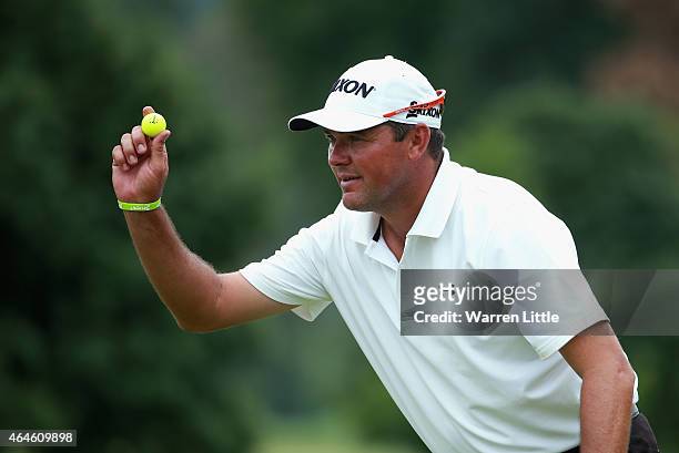 Wallie Coetsee of South Africa acknowledges the crowd on the 18th green during the second round of the Joburg Open at Royal Johannesburg and...