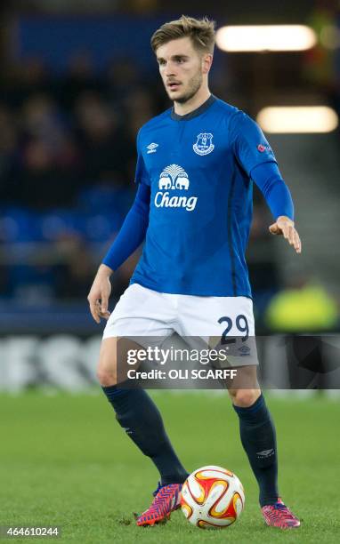 Everton's English defender Luke Garbutt plays the ball during the UEFA Europa League round of 32 second leg football match between Everton FC and BSC...