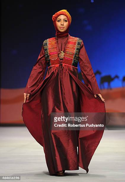 Model showcases designs by Nieta Hidayani on the runway in the Lune de Feu show during Indonesia Fashion Week 2015 at Jakarta Convention Center on...