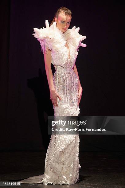 Model walks the runway during the Serkan Cura show as part of Paris Fashion Week Haute Couture Spring/Summer 2014 on January 23, 2014 in Paris,...