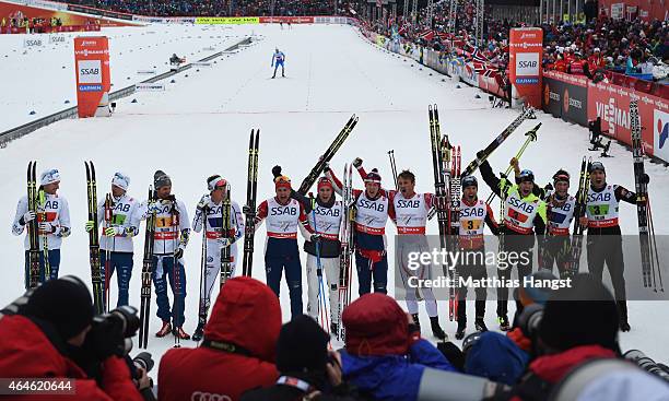 Gold medallists Niklas Dyrhaug, Didrik Toenseth, Anders Gloeersen and Petter Jr. Northug of Norway celebrate with silver medallists Daniel...