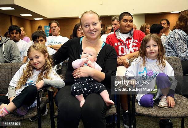 Irit Streett , daughters Alma age 7, Zohar age 5, and Mila 3 months old attend the Starkey Hearing Foundation Mission during GRAMMY Camp at...