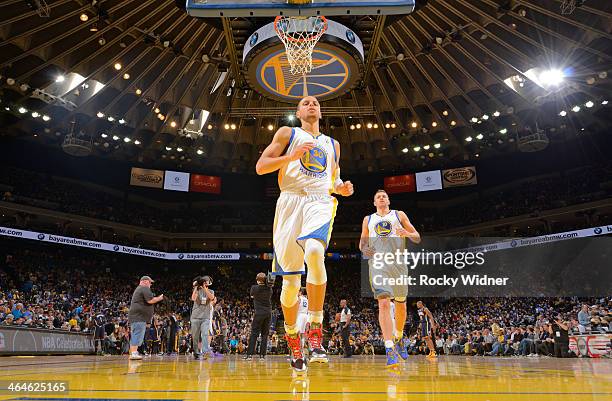 Stephen Curry and David Lee of the Golden State Warriors race to the hoop prior to the game against the Indiana Pacers on January 20, 2014 at Oracle...