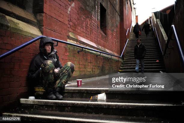 Man begs for loose change on the streets of Manchester on February 25, 2015 in Manchester, United Kingdom. As the United Kingdom prepares to vote in...