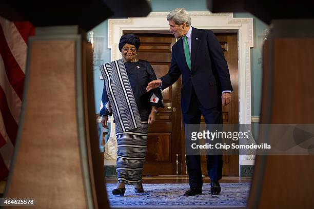 Liberia President Ellen Johnson Sirleaf and U.S. Secretary of State John Kerry arrive for a media availability in the Treaty Room at the Department...