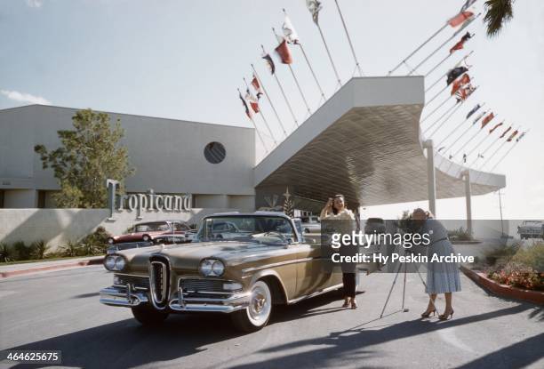 Actress and model Kitty Dolan poses next to a 1958 Ford Edsel Citation outside The Tropicana Hotel in 1958 in Las Vegas, Nevada.