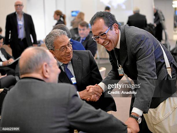 Amr Moussa , Secretary-General of the League of Arab States shakes hands with other participants during the Annual Meeting 2014 of the World Economic...