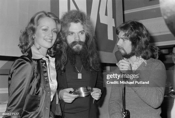 Singer-songwriter and musician Roy Wood, of English pop group Wizzard , with disc jockey Noel Edmonds at the Disc magazine readers' poll awards,...