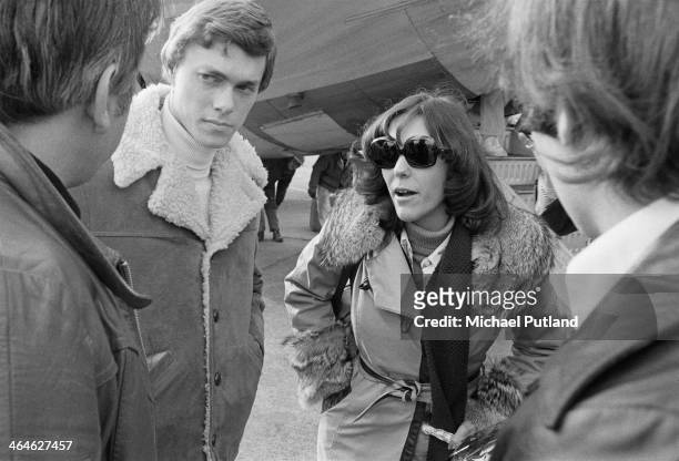 American pop duo The Carpenters, Karen Carpenter and her brother Richard, at an airport during a European tour, February 1974.