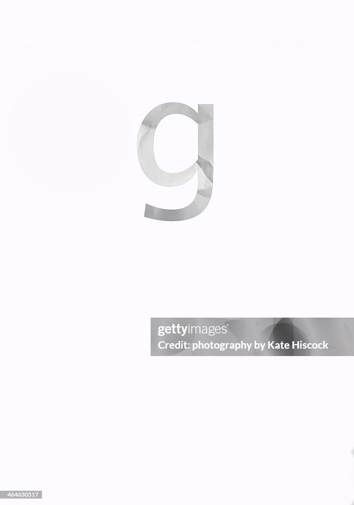 Lowercase letter g - paper cut