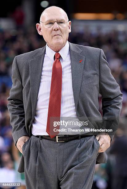 Head coach George Karl of the Sacramento Kings walks onto the floor after calling a timeout against the Boston Celtics in the first quarter of their...