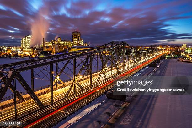 luminous alexandra bridge in winter - ottawa city stock pictures, royalty-free photos & images