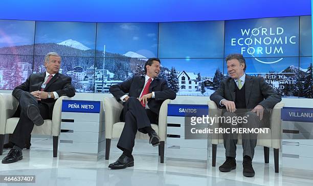 Mexican President Enrique Pena Nieto talks talks with Colombian President Juan Manuel Santos flnanked by Chile's Finance Minister Felipe Larrain at...