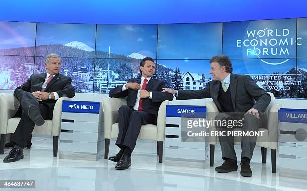 Mexican President Enrique Pena Nieto talks talks with Colombian President Juan Manuel Santos flnanked by Chile's Finance Minister Felipe Larrain at...
