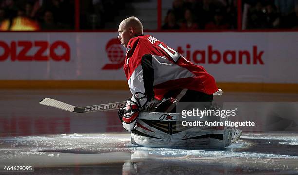 Craig Anderson of the Ottawa Senators stretches in his crease during player introductions prior to a game against the Phoenix Coyotes at Canadian...