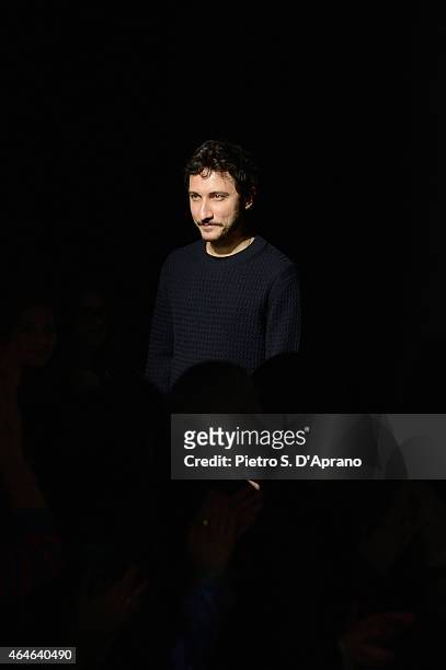 Designer Marco De Vincenzo acknowledges the audience following the Marco De Vincenzo show during the Milan Fashion Week Autumn/Winter 2015 on...