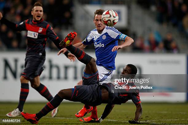 Rafael Kazior of Kiel and Steve Gohouri of Erfurt compete the ball during the Third League match between Holstein Kiel and RW Erfurt at...