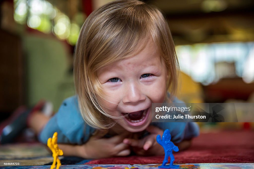 Child Playing and Having Fun With a Board Game