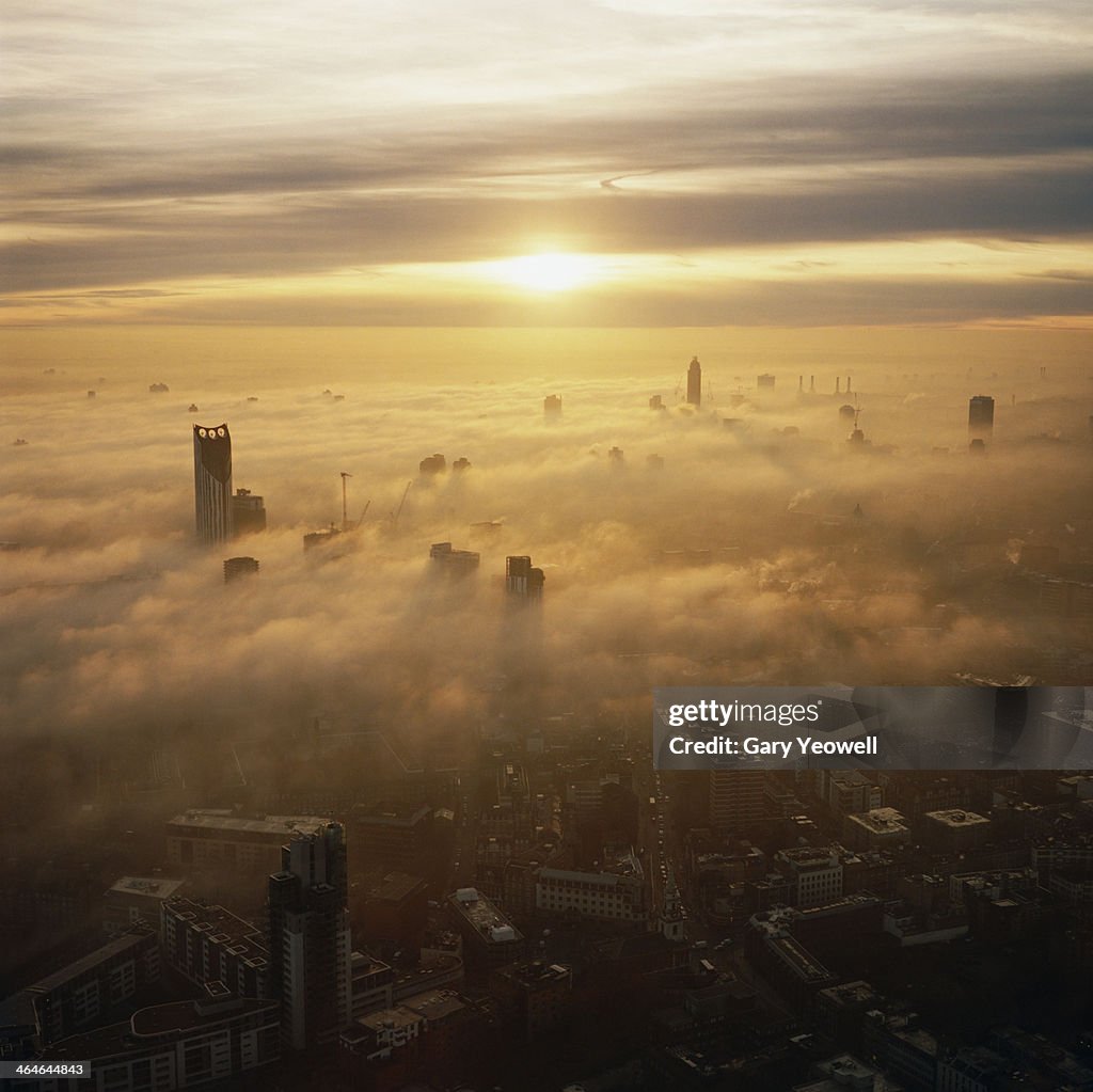 Elevated view over London shrouded in mist