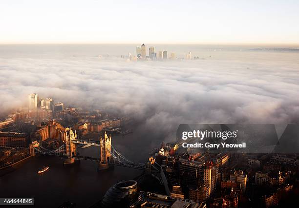 elevated view over london shrouded in mist - fog london stock pictures, royalty-free photos & images