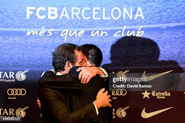 Vice-President Josep Maria Bartomeu hugs FCB President Sandro Rosell after the press conference announcing his resgination as FCB president on...