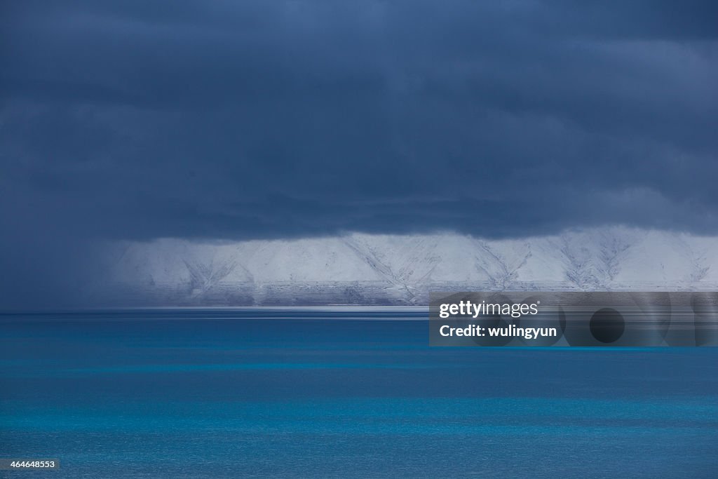 Tibet blue lake with heavery cloudy