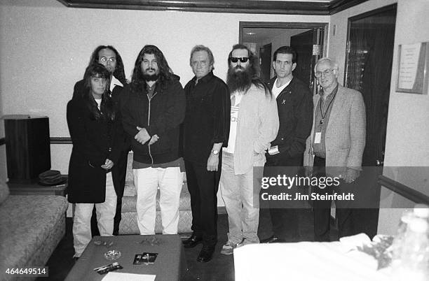 Johnny Cash poses with Rick Rubin, Lou Robin and others backstage at the Greek Theatre in Los Angeles, California on June 14, 1997.