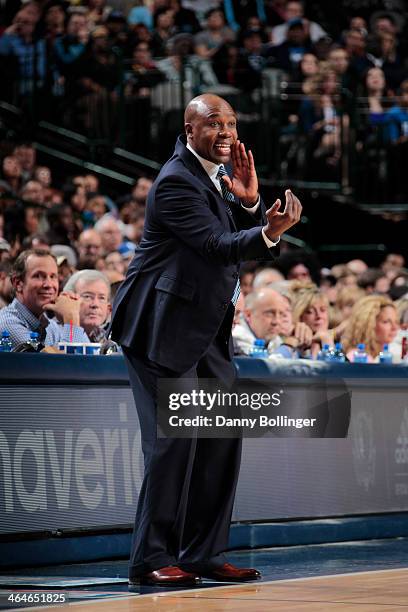 Jacque Vaughn of the Orlando Magic coaches from the bench against the Dallas Mavericks on January 13, 2014 at the American Airlines Center in Dallas,...