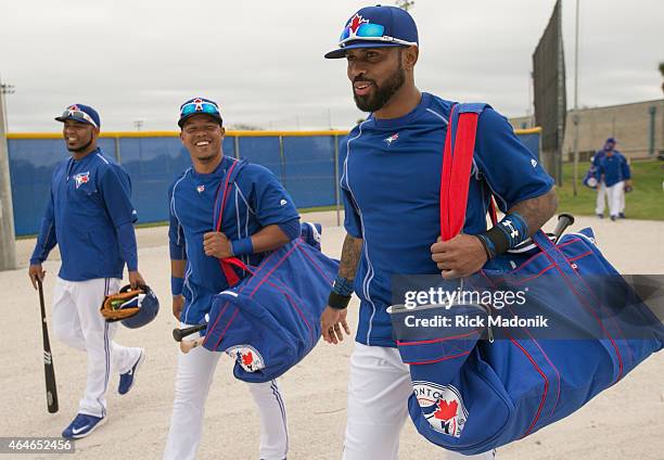 Headed to the warm up area is, from right, Jose Reyes, Ramon Santiago and Edwin Encarnacion. The Jays work out at the Bobby Mattock Training Facility...