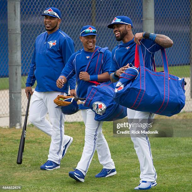 Headed to the warm up area is, from right, Jose Reyes, Ramon Santiago and Edwin Encarnacion. The Jays work out at the Bobby Mattock Training Facility...