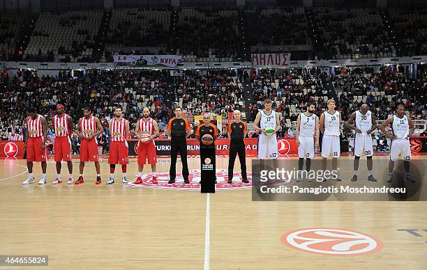 Teams line up for a group photo during the Turkish Airlines Euroleague Basketball Top 16 Date 8 game between Olympiacos Piraeus v Unicaja Malaga at...