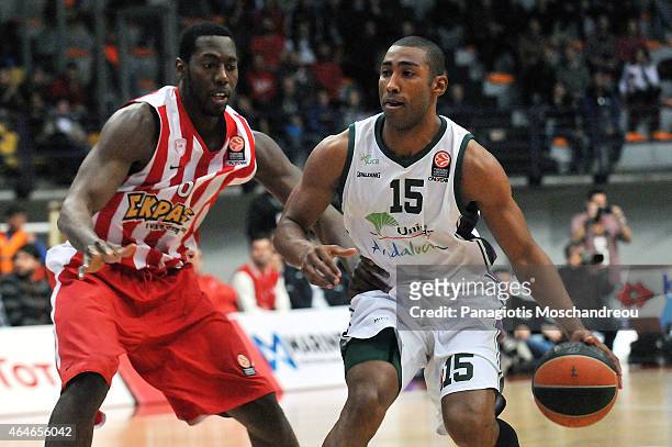 Bryant Dunston, #6 of Olympiacos Piraeus competes with Jayson Granger, #15 of Unicaja Malaga during the Turkish Airlines Euroleague Basketball Top 16...