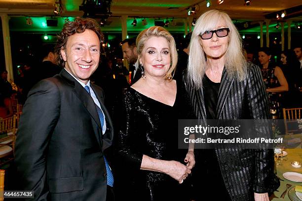 Stephane Bern, actress Catherine Deneuve and Betty Catroux attend the Sidaction Gala Dinner 2014 at Pavillon d'Armenonville on January 23, 2014 in...