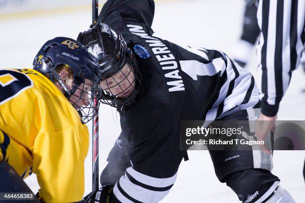 Ross Mauermann of the Providence College Friars faces-off against the Merrimack College Warriors during NCAA hockey action in the "Citi Frozen Fenway...