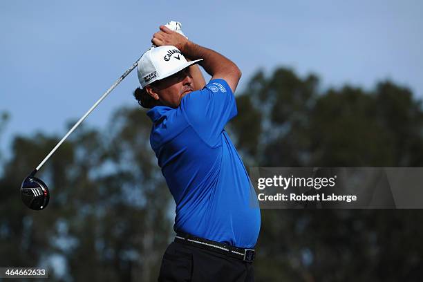 Pat Perez hits a tee shot on the 9th hole during the first round of the Farmers Insurance Open on Torrey Pines South on January 23, 2014 in La Jolla,...