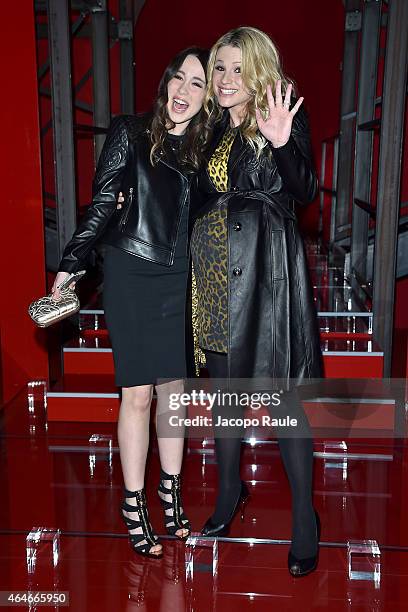 Aurora Ramazzotti and Michelle Hunziker attend the Versace show during the Milan Fashion Week Autumn/Winter 2015 on February 27, 2015 in Milan, Italy.