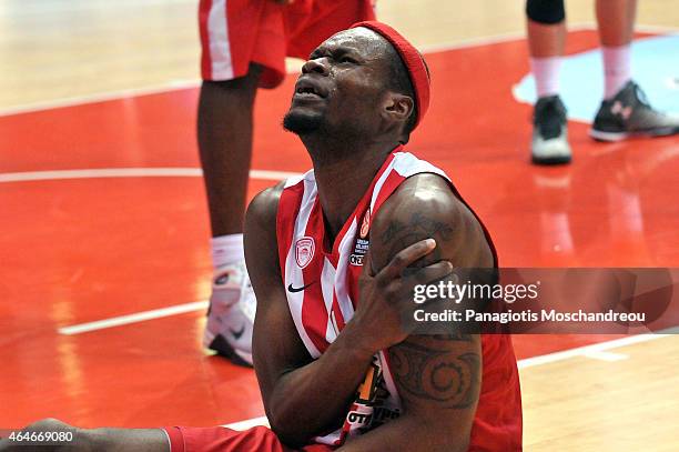 Brent Petway, #4 of Olympiacos Piraeus react as he falls injured during the Turkish Airlines Euroleague Basketball Top 16 Date 8 game between...