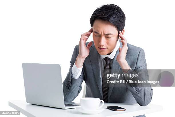 businessman having a headache - mobile massage table stock pictures, royalty-free photos & images