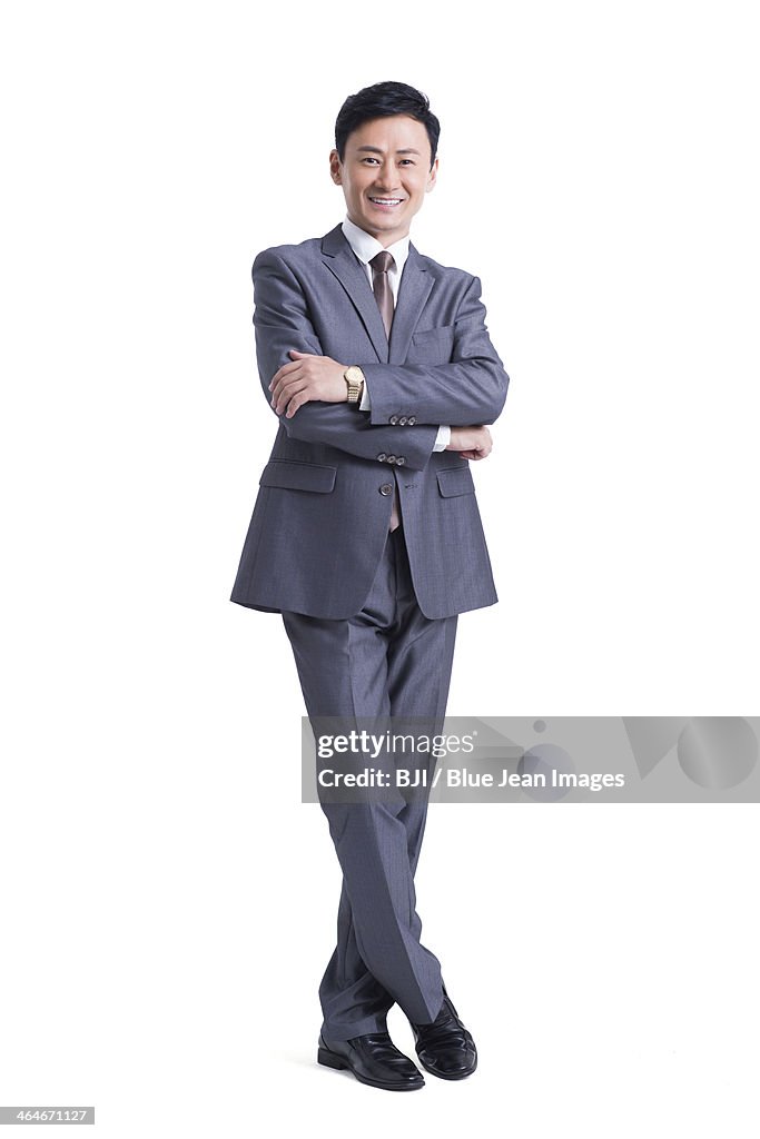 Mature businessman with arms crossed