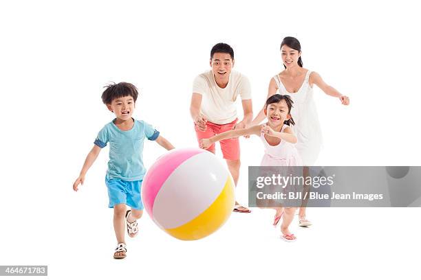 happy family playing beach ball - girls on white background stock pictures, royalty-free photos & images