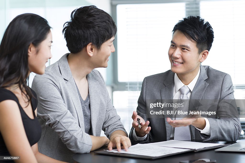 Young couple with financial consultant